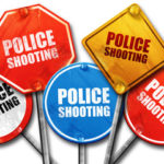 signs that read police shooting