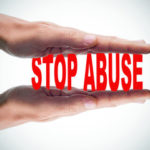 sign that reads stop abuse