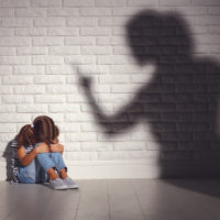 domestic violence. angry mother scolds   frightened daughter