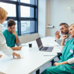 Group of medical professionals brainstorming in meeting