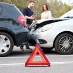 People checking car damages after car accident