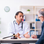 Male doctor in courthouse meeting with lawyer