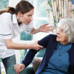 Care Worker Mistreating Senior Woman At Home