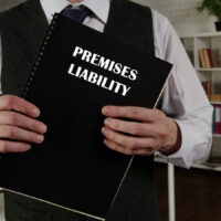 Lawyer holds PREMISES LIABILITY book. Premises liability is the liability that a landowner or occupier has for certain torts that occur on their land