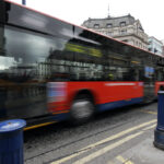 red bus in the traffic