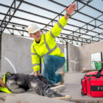 First Aid for Emergency Accidents at Construction Sites. Construction worker was injured in a fall from a height at a construction site. Engineers help First Aid, Safety team helps employees accident.