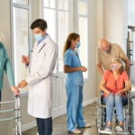 Seniors and hospital staff with mask in the nursing home