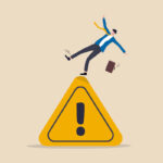 Mistake caution, business risk or problem warning, failure prevention or avoid danger concept, cautious businessman slip falling on exclamation symbol beware, careful caution sign.